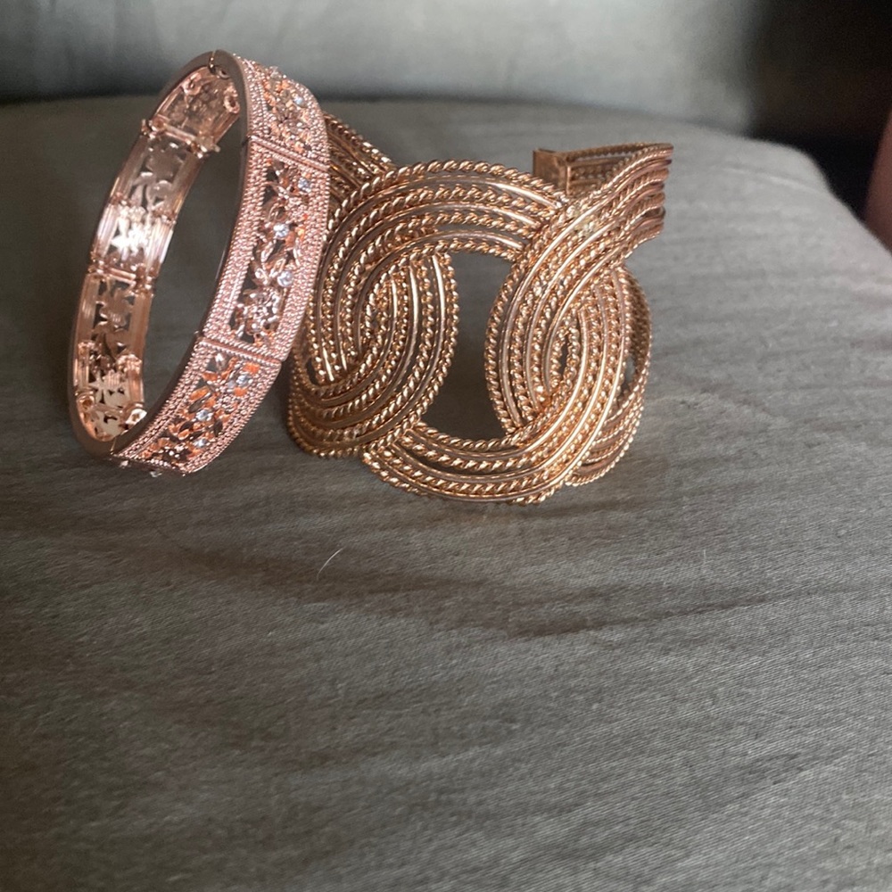 2 gold bracelets.